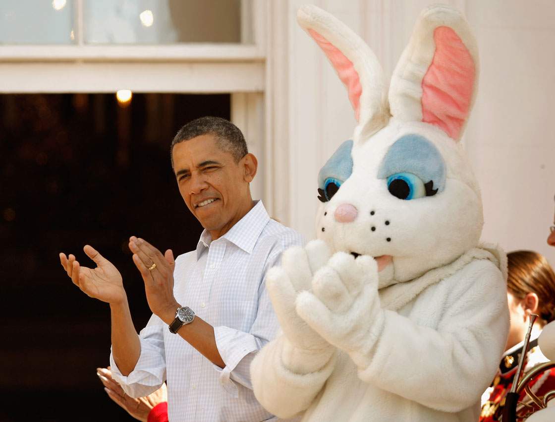 U.S. President Barack Obama stands with a person in an Easter rabbit costume during the annual Easter Egg Roll on the South Lawn of the White House April 9, 2012 in Washington, DC. 