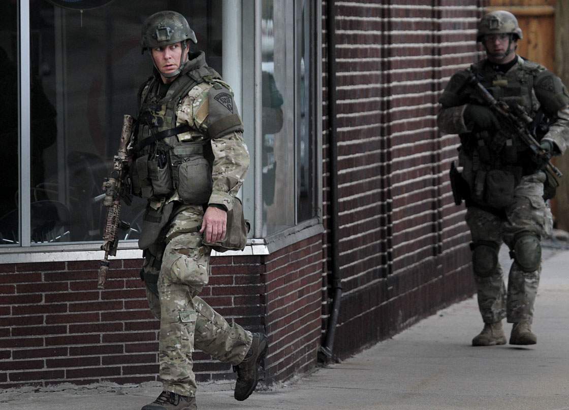 State Police search on Mount Auburn Street as a manhunt is underway for a suspect in the terrorist bombing of the 117th Boston Marathon earlier this week.