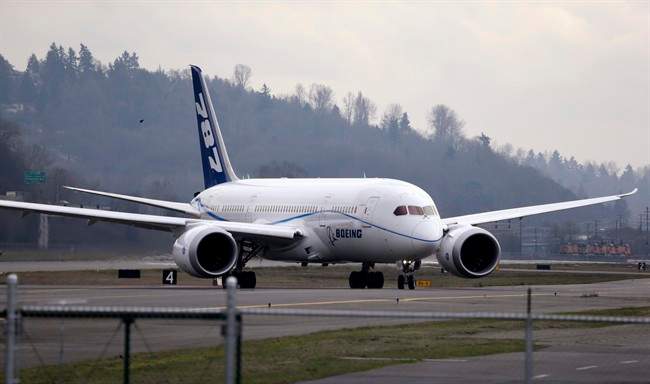 FILE - This Feb. 11, 2013 file photo shows a Boeing 787 flight test jet taxing following a test flight, at Boeing Field, in Seattle.