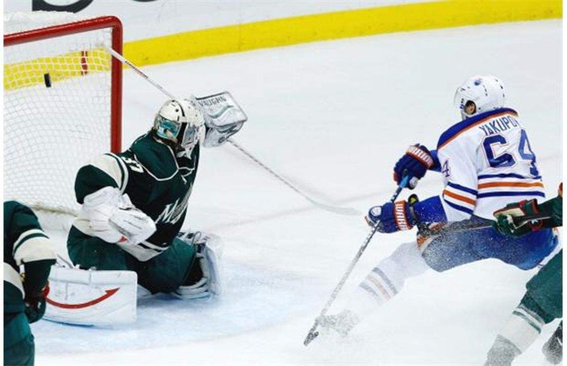 Edmonton Oilers right wing Nail Yakupov scores on Minnesota Wild goalie Josh Harding during the second period of NHL action in St. Paul, Minn., Friday, April 26, 2013.
