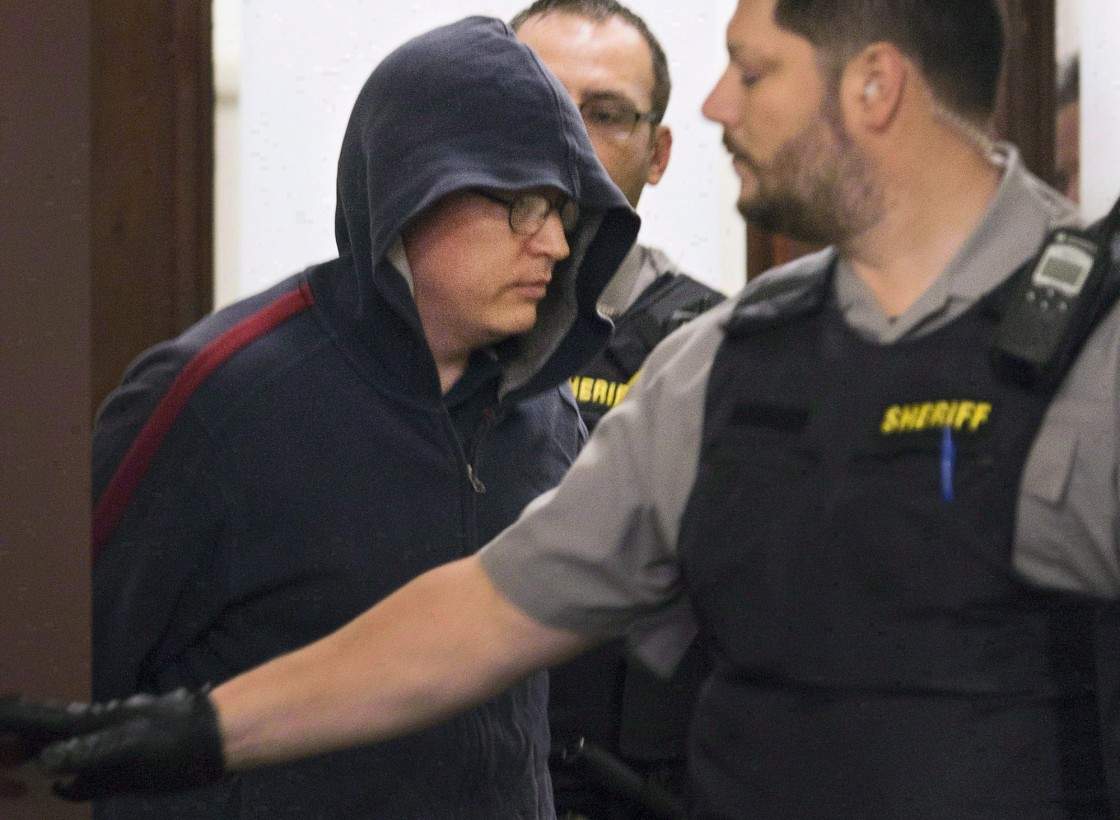 Jeffrey Paul Delisle leaves court in Halifax on Oct. 10, 2012.