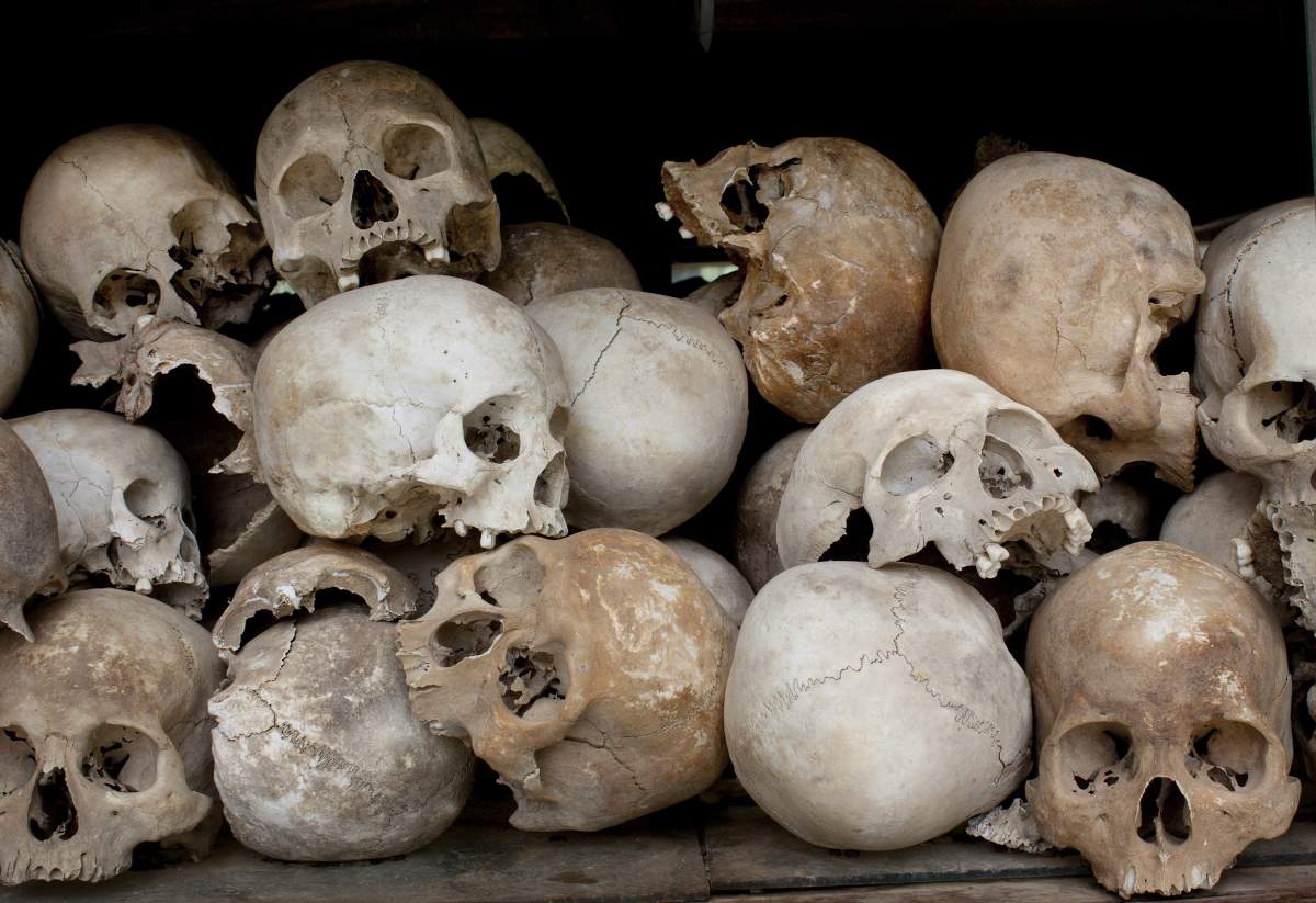 PHNOM PENH, CAMBODIA : Some of the 8,000 human skulls sit in a glass case at the Choeung Ek Genocidal Center.
