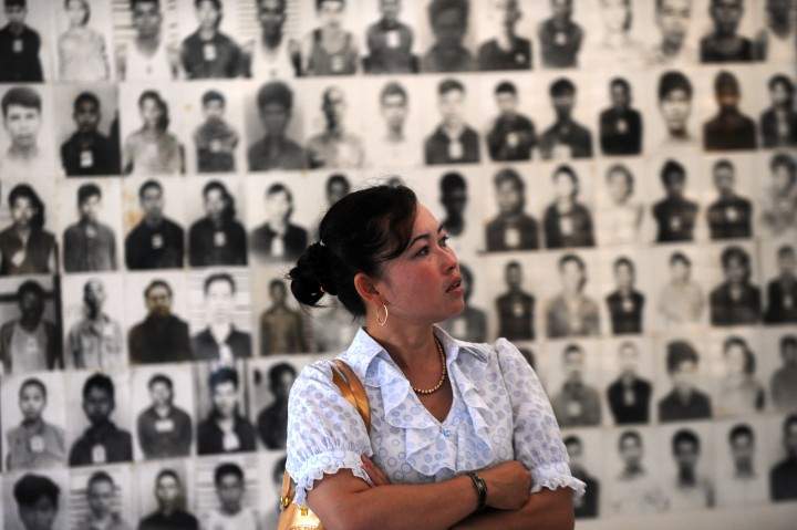 A Cambodian woman looks at portraits of victims of the Khmer Rouge at the Tuol Sleng genocide museum in Phnom Penh. 