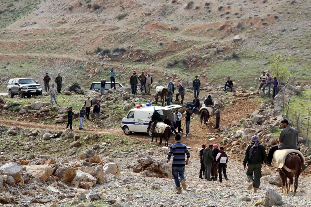 Syrian refugees arrive in the southern Lebanese town of Shebaa after fleeing their village near the border with Lebanon on March 21, 2013.