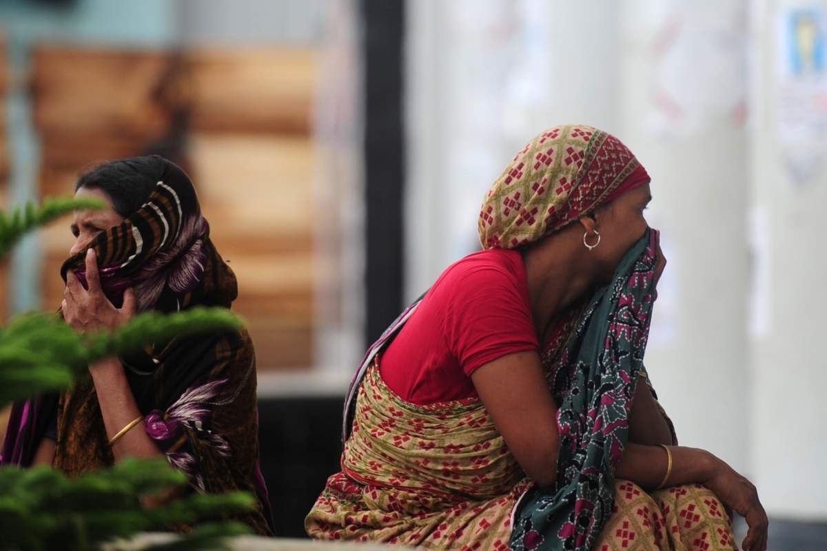 Fire officials say the fire broke out late Wednesday. By early
Thursday, firefighters had found eight people dead. (MUNIR UZ ZAMAN/AFP/Getty Images).