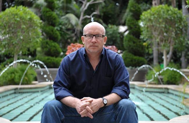 Alex Gibney poses for a portrait at the Four Seasons in Los Angeles. Gibney is the director of the documentary film, "We Steal Secrets: The Story of WikiLeaks," releasing in the US on May 24, 2013.