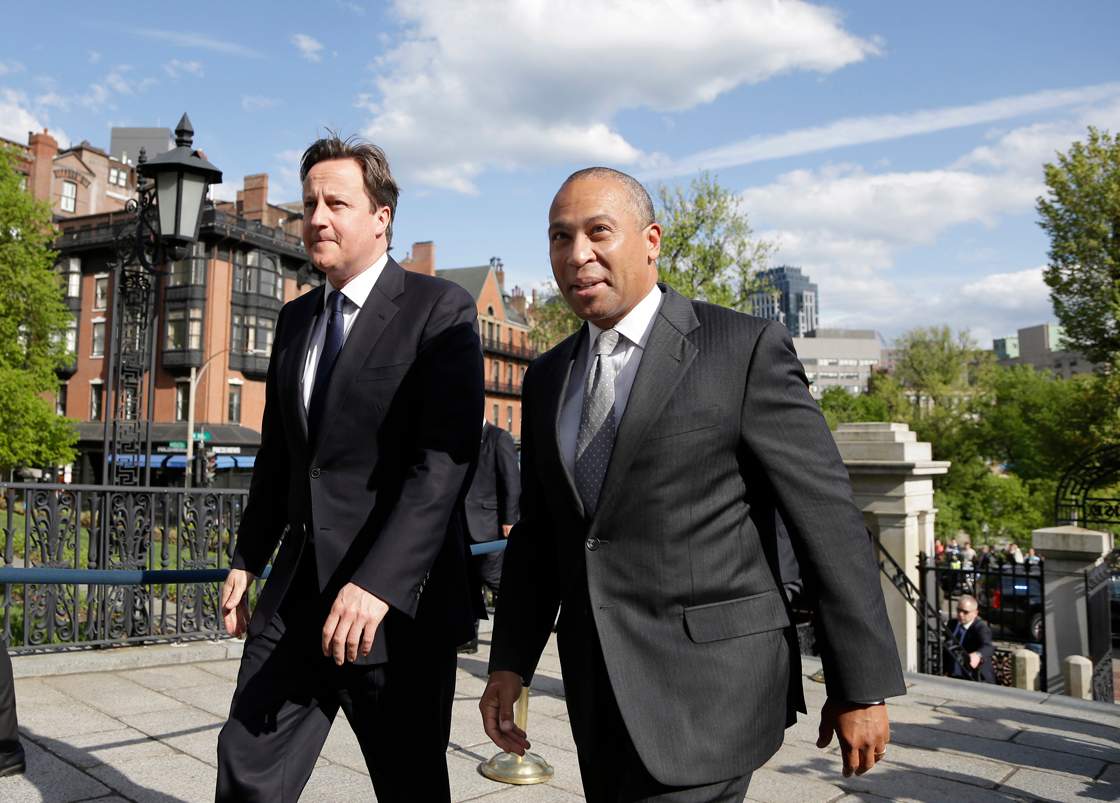 British Prime Minister David Cameron, left, walks with Massachusetts Gov. Deval Patrick into the Massachusetts Statehouse in Boston, Monday, May 13, 2013. Cameron met with Patrick to offer his condolences and discuss lessons that can be learned from the Boston Marathon attacks. 