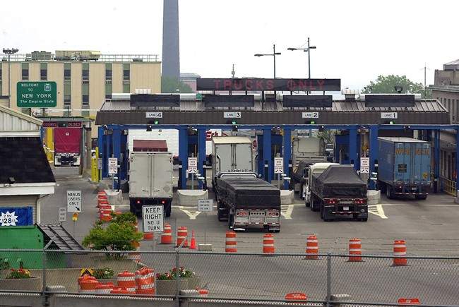 Transport traffic entering the United States line-up for the customs inspection plaza after crossing the Peace Bridge from Canada in Buffalo, N.Y., on May 26, 2004.