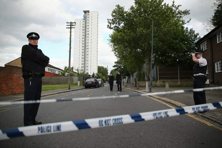 Police at the scene in Woolwich following a major incident in which a man was killed, on May 22, 2013 in London, England. It has been reported that the government and police are treating the attack in Woolwich on a serving soldier as a possible terrorist attack. Police have confirmed that one man has died after being attacked in the street by two men and firearms and knives were involved in the incident.