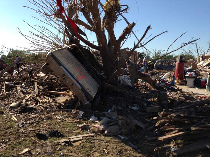 A storm rolled in early May 23 in Moore, OK, keeping people from sorting through the rubble where their houses once stood after Monday’s massive tornado. Mike Drolet / Global News