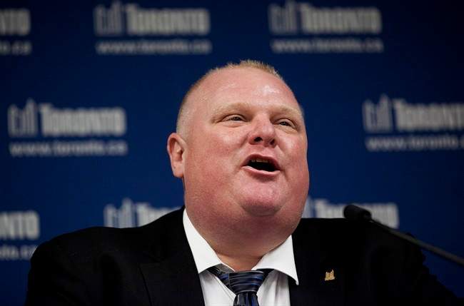 Toronto Mayor Rob Ford leaves city hall after making a statement to the media on Friday.