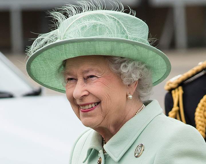 Queen Elizabeth II is greeted on her arrival during a visit to The King’s Troop Royal Horse Artillery unit at Woolwich Barracks on May 31, 2013 in Woolwich, England. (Photo credit: AP Photo)