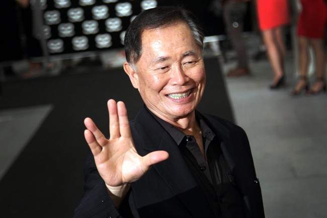 American actor George Takei gestures with a hand greeting made popular by the Television series Star Trek arrives at the Marina Bay Sands hotel on Thursday, May 23, 2013 in Singapore for the inaugural Social Star Awards.