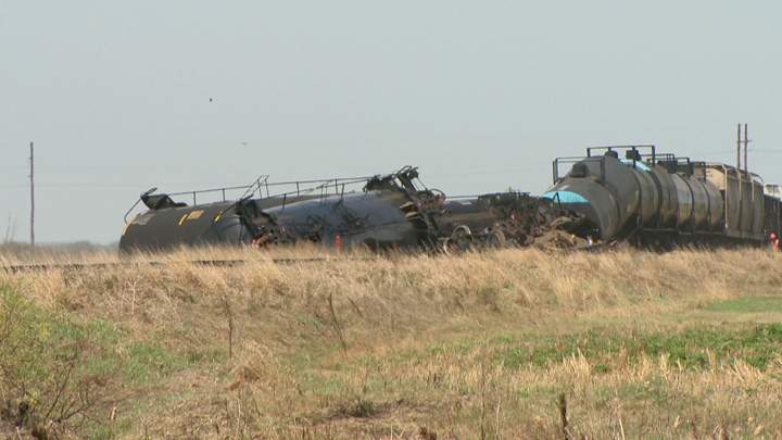 Dirt containment wall built when oil leaks after Saskatchewan train derailment.