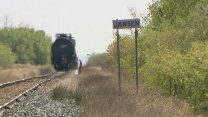 Dirt containment wall built when oil leaks after Saskatchewan train derailment.