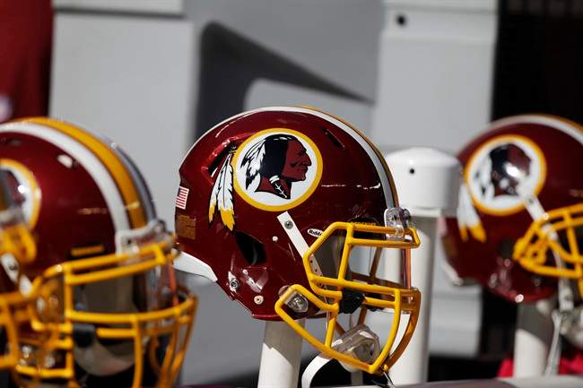 In this Oct. 21, 2012 file photo, Washington Redskins helmets are shown during the first half of an NFL football game in East Rutherford, N.J. The team's nickname, which some consider a derogatory term for Native Americans, has faced a barrage of criticism. Local leaders and pundits have called for a name change. Opponents have launched a legal challenge intended to deny the team federal trademark protection. A bill introduced in Congress in March would do the same, though it appears unlikely to pass. But a new Associated Press-GfK poll shows that nationally, “Redskins” still enjoys widespread support. (AP Photo/Kathy Willens, File).