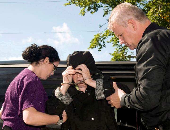 Melissa Ann Shepard, also known as the "Black Widow," leaves a Cape Breton Regional Police Services vehicle for a court appearance at the Sydney Justice Centre, Tuesday, Oct.2, 2012. 