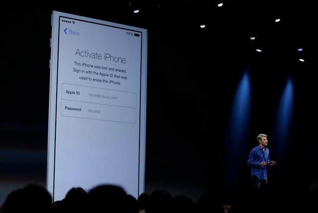 Craig Federighi, senior vice president of Software Engineering at Apple demonstrates the new activation lock security feature in iOS 7 during the keynote address of the Apple Worldwide Developers Conference Monday, June 10, 2013 in San Francisco. 