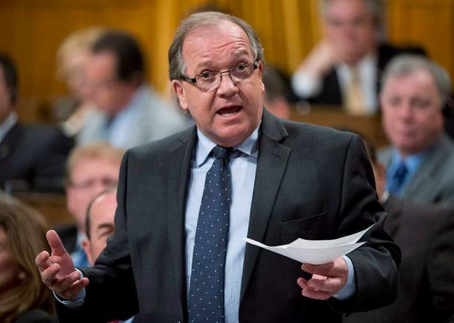 Aboriginal Affairs Minister Bernard Valcourt responds to a question during question period in the House of Commons Tuesday May 28, 2013 in Ottawa.