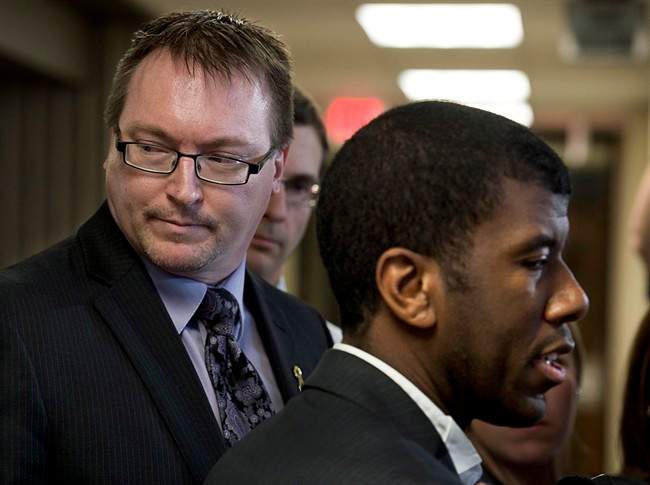 Trevor Zinck, left, accompanied by his lawyer Lyle Howe, right, talks with reporters outside Nova Scotia Supreme Court in Halifax on Monday, June 17, 2013.