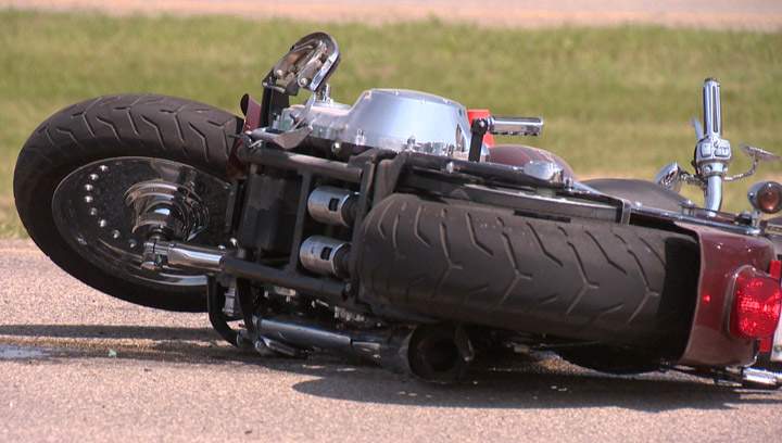 Rear tires comes off of passing truck and hits motorcyclist.