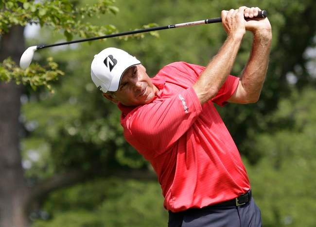 Fred Couples tees off on the second hole during the final round of the Encompass Championship golf tournament on Sunday, June 23, 2013, in Glenview, Ill. 