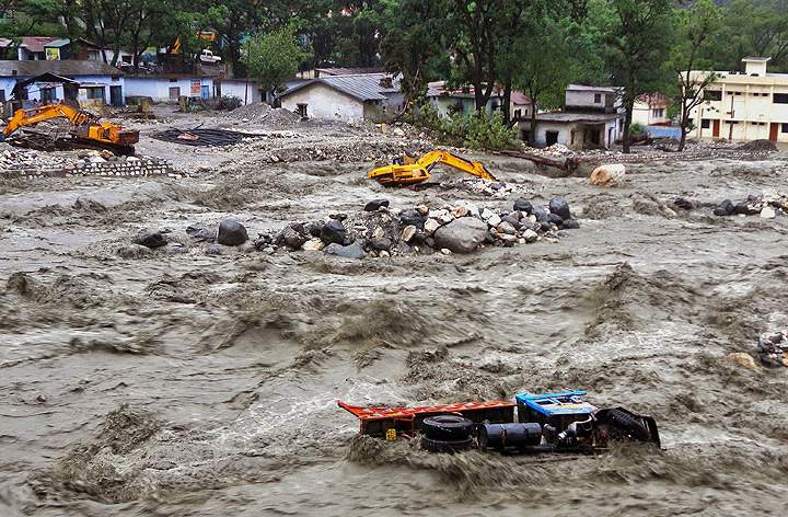 Many third-world countries face repercussions from global warming, like India, where severe flooding has washed out roads and collapsed buildings on June 17.