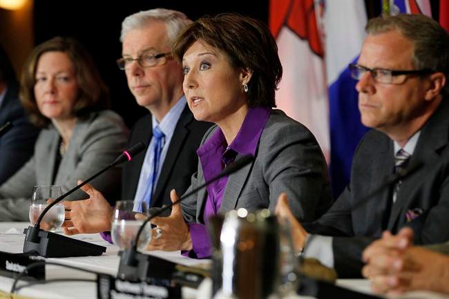 Alberta Premier Alison Redford, (left to right) Manitoba Premier Greg Selinger and Saskatchewan Premier Brad Wall listen in as British Columbia Premier Christy Clark responds to media questions during the press conference for the 2013 Western Premier's Conference in Winnipeg, Monday, June 17, 2013. 