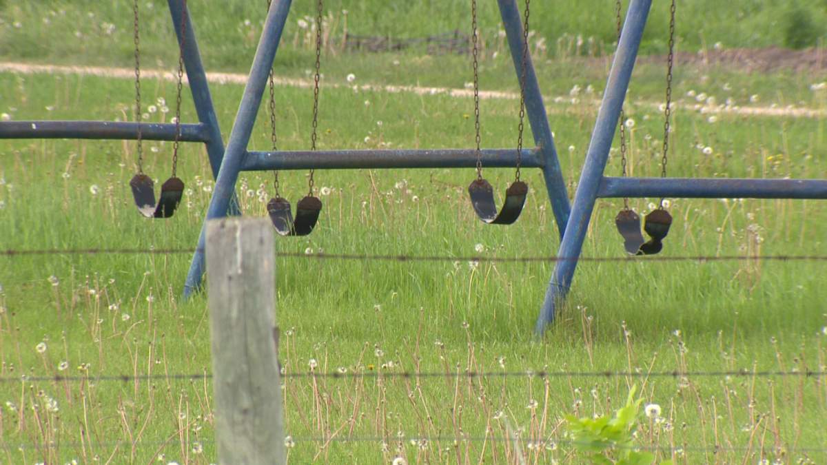 A swing set sits idle after children were seized from a small Old Order Mennonite community in Manitoba.