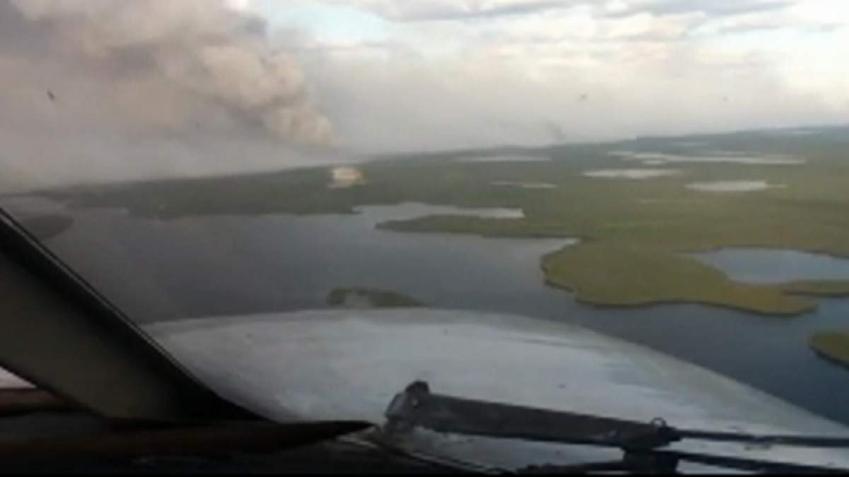 A fire burns near Ilford, in northern Manitoba, in early June. Fires in the region are expected to significantly impact air quality.