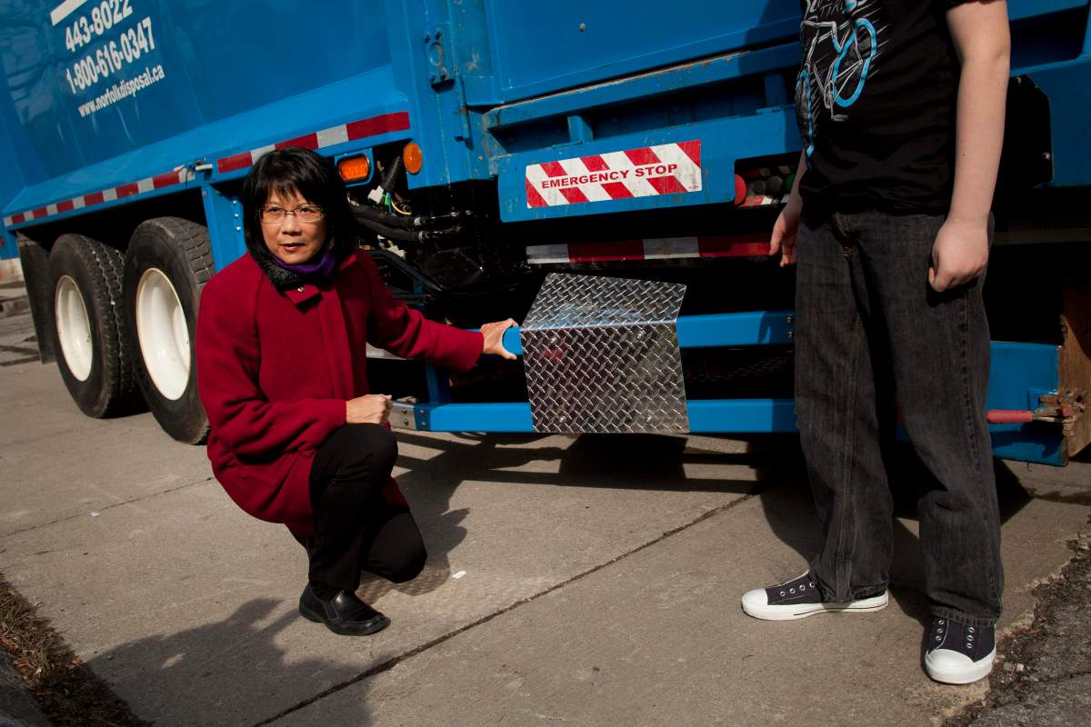 MP Olivia Chow shows a side guard device on a truck at a press conference in Toronto April 9, 2013. The event, led by Chow, was a call for the mandatory use of life-saving side guards on large trucks. (Moe Doiron/The Globe and Mail).