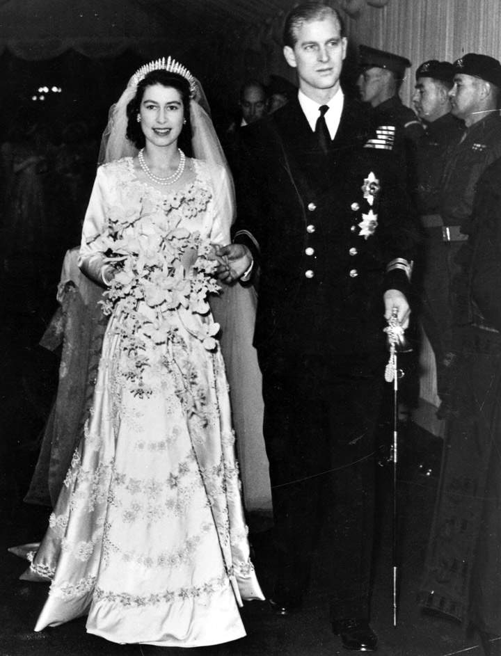 Queen Elizabeth II, as Princess Elizabeth, and her husband the Duke of Edinburgh, styled Prince Philip in 1957, on their wedding day in 1947. She became queen on her father King George VI’s death in 1952. (Photo credit: Getty Images)
