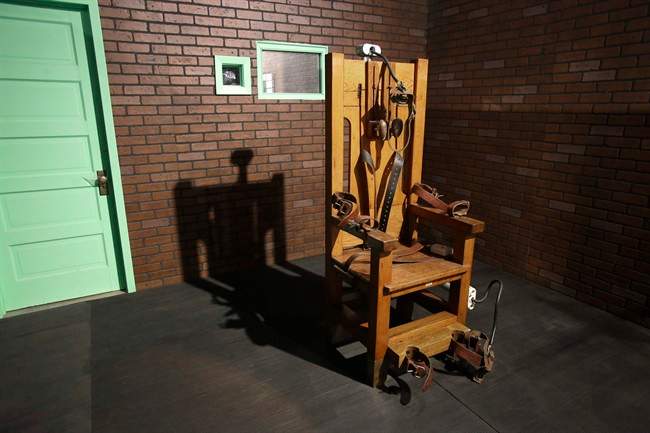 This photo taken May 16, 2013, shows an electric chair on exhibit at the Texas Prison Museum in Huntsville, Texas. 