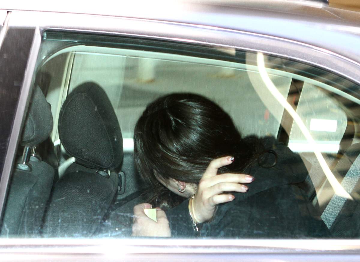A woman is brought into custody in connection with the death of Mackenzy Jane Woolfsmith in May 2012. The woman was arrested July 16, 2013 with murder charges pending. Jim Wells/Calgary Sun/QMI Agency