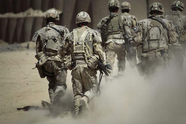 Canadian soldiers shown on patrol outside Salavat, in the Panjwayi district, southwest of Kandahar, Afghanistan, Monday, June 7, 2010. Almost 14 per cent of Canadian Forces members who served in the Afghanistan mission were diagnosed with a mental health disorder linked directly to their tour, according to a military study.
