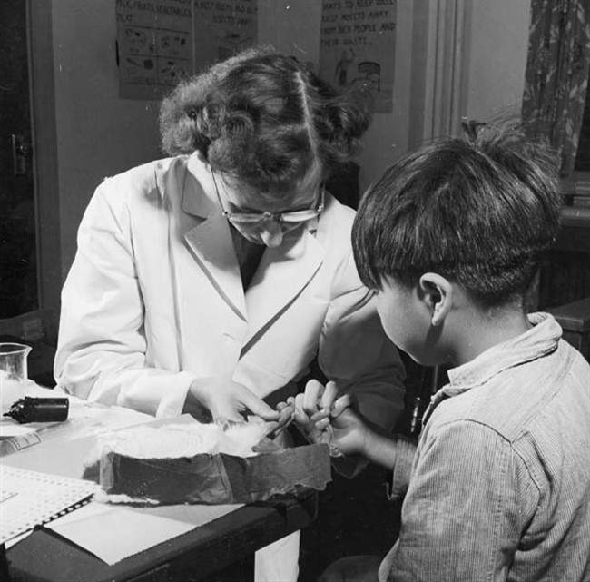 A nurse takes a blood sample from a boy at a residential school in Port Alberni, B.C., in 1948, during the time when nutritional experiments were being conducted on students.
