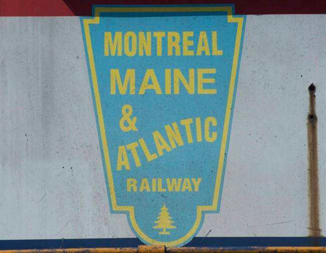 A logo for Montreal Maine and Atlantic railway is shown on a MMA locomotive engine outside their offices in the town of Farnham, Que.