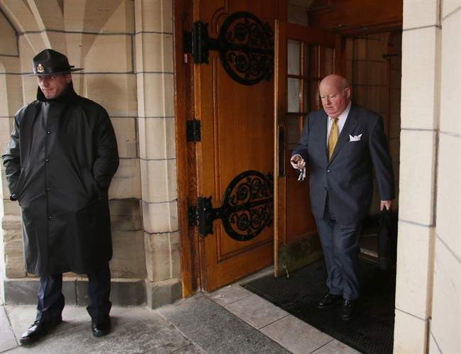 Conservative Senator Mike Duffy leaves Parliament Hill, in Ottawa, on June 6, 2013. THE CANADIAN PRESS/Fred Chartrand.