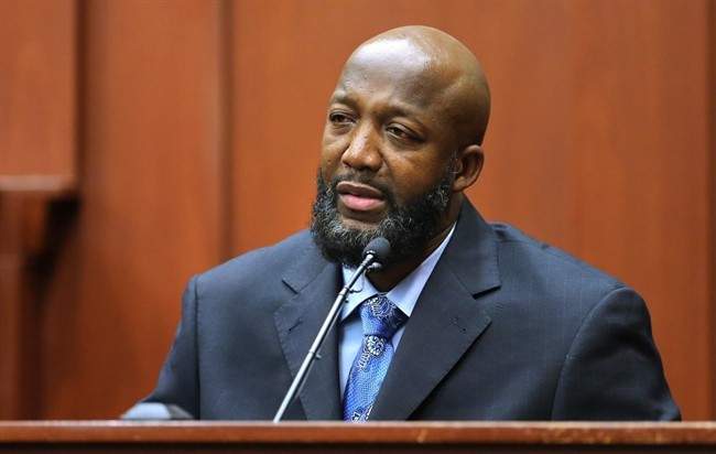Tracy Martin, the father of Trayvon Martin, testifies in George Zimmerman's trial at the Seminole Circuit Court, in Sanford, Fla., Monday, July 8, 2013. Zimmerman is charged with second-degree murder in the fatal shooting of his son, in 2012.