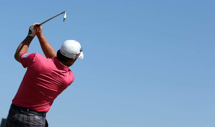 Northern Ireland’s Graeme McDowell plays the 16th tee during the second round of the 2013 British Open Golf Championship at Muirfield golf course at Gullane in Scotland on July 19, 2013 . (Photo credit: ADRIAN DENNIS/AFP/Getty Images)