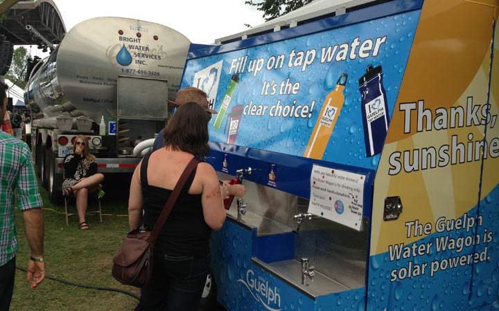A water tanker pumps out free drinking water to Hillside Festival attendees, volunteers and performers. July 28, 2013. (Photo credit: Heather Loney)