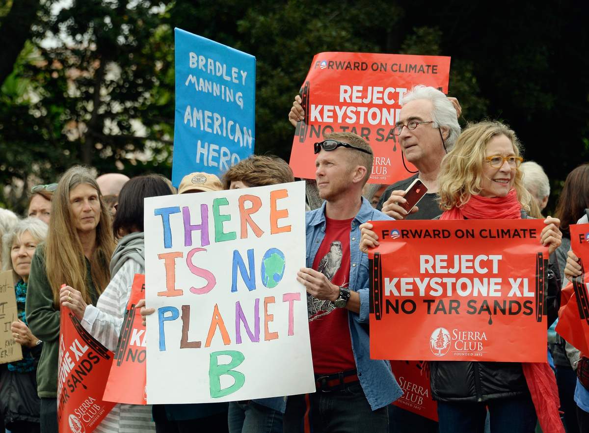SANTA MONICA, CA - JUNE 07: Protestors against the Keystone XL tar sands pipeline and families facing deportations demonstrate at a visit by President Barack Obama to a Democratic National Committee fundraiser on June 7, 2013 in Santa Monica, California.