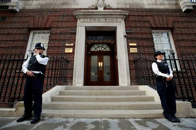 British police officers guard the entrance of St. Mary's Hospital exclusive Lindo Wing in London, Monday, July 22, 2013.