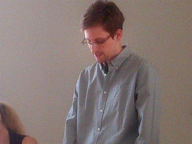 This image provided by Human Rights Watch shows NSA leaker, Edward Snowden looking down during a press conference at Moscow's Sheremetyevo Airport, Friday, July 12, 2013. 