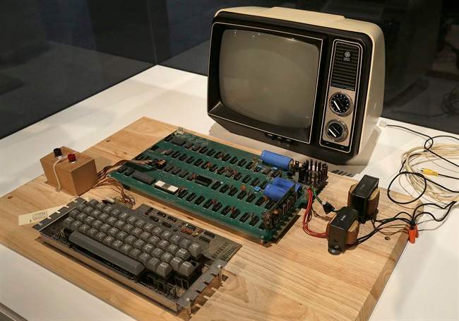 An Apple 1 computer for sale at auction is seen in a Monday, June 24, 2013 file photo, at the Computer History Museum in Menlo Park, Calif. The computer sold on Monday, Jully 8, 2013 for $387,750 at a Christie's online-only auction. The auction house did not disclose the name of the buyer.