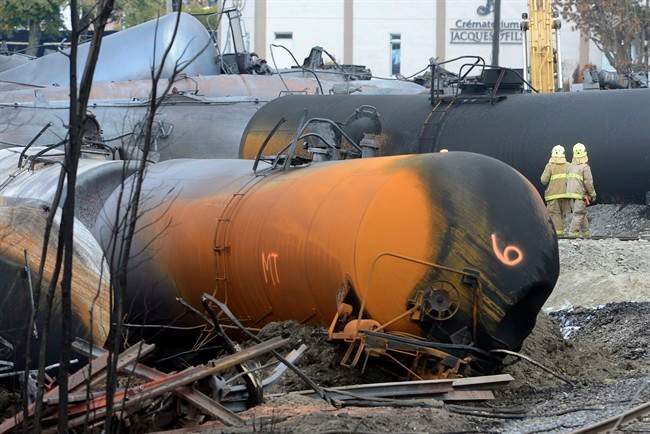 Work continues at the crash site of the train derailment and fire Tuesday, July 16, 2013 in Lac-Megantic, Que. that left 37 people confirmed dead and another 13 missing and presumed dead.
