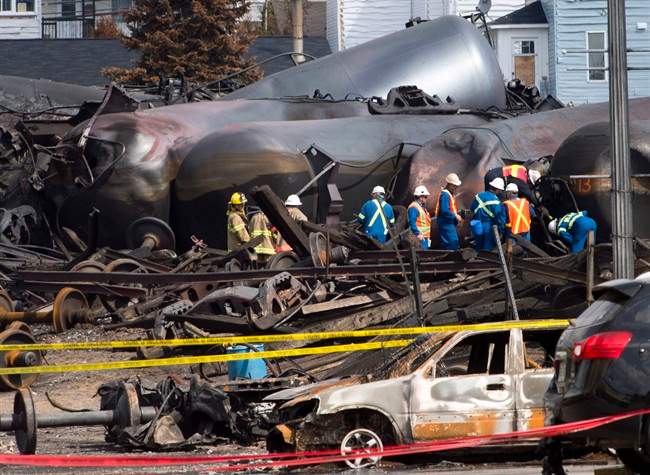 Work continues at the crash site of the train derailment and fire Tuesday, July 16, 2013 in Lac-Megantic, Que.