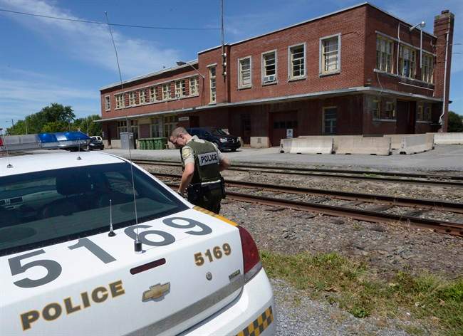 Surete du Quebec investigators work at the Montreal, Maine and Atlantic Railway Inc. office in Farnham, Que., on Thursday, July 25, 2013.