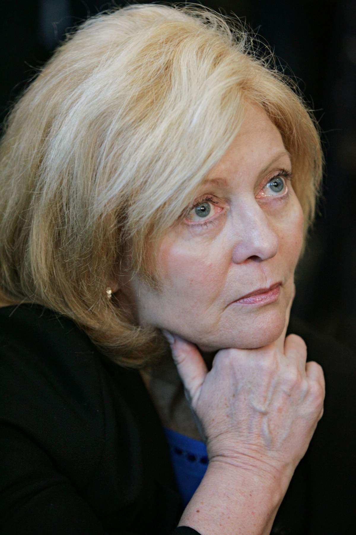 Conservative Leader Stephen Harper's press secretray Carolyn Stewart-Olsen watches Harper address the media during a campaign stop at the Evergreen Seniors Centre in Guelph, Ont. Friday, Dec. 9, 2005.(CP PHOTO/Jonathan Hayward).