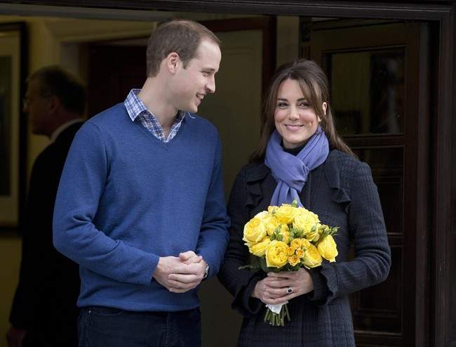 FILE - In this Thursday, Dec. 6, 2012 file photo Britain's Prince William stands next to his wife Kate, Duchess of Cambridge as she leaves the King Edward VII hospital in central London.